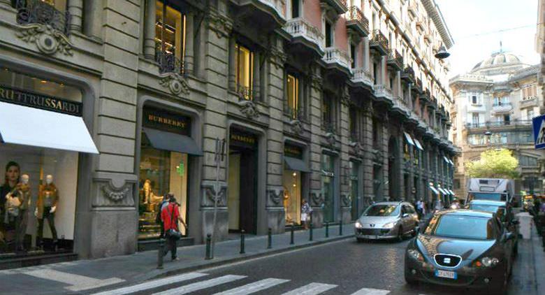 Louis Vuitton and the steps that lead up from the store in Via dei Mille in  Naples, Italy