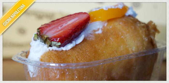 Photo of a Babà with cream and fruit