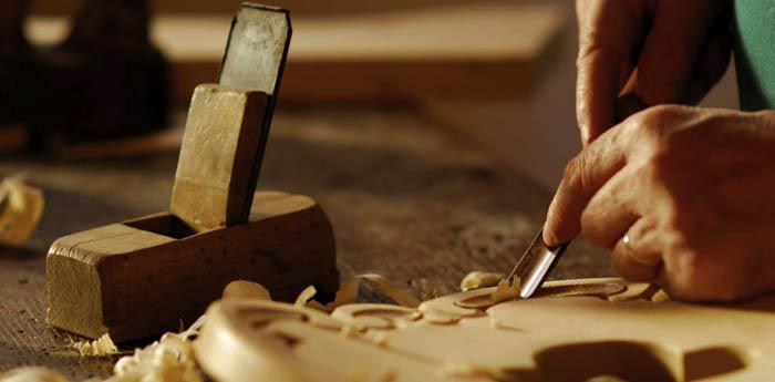 a craftsman works on his hand-made work