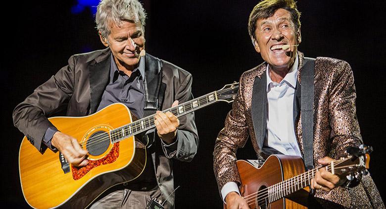 Gianni Morandi and Claudio Baglio in concert at the Palapartenope in Naples