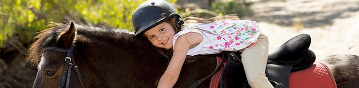 A little girl on horseback