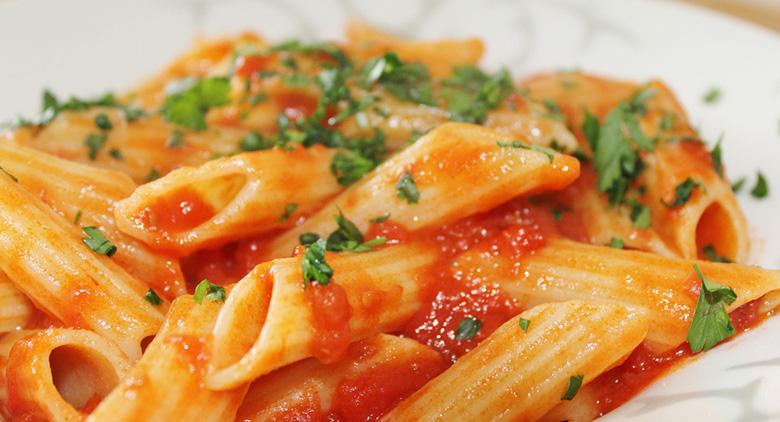 Plate of penne all'arrabbiata, festival in Marigliano