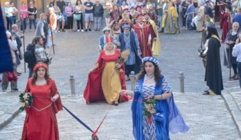 Medieval re-enactment in Caiazzo with procession of figures, flag-wavers and music
