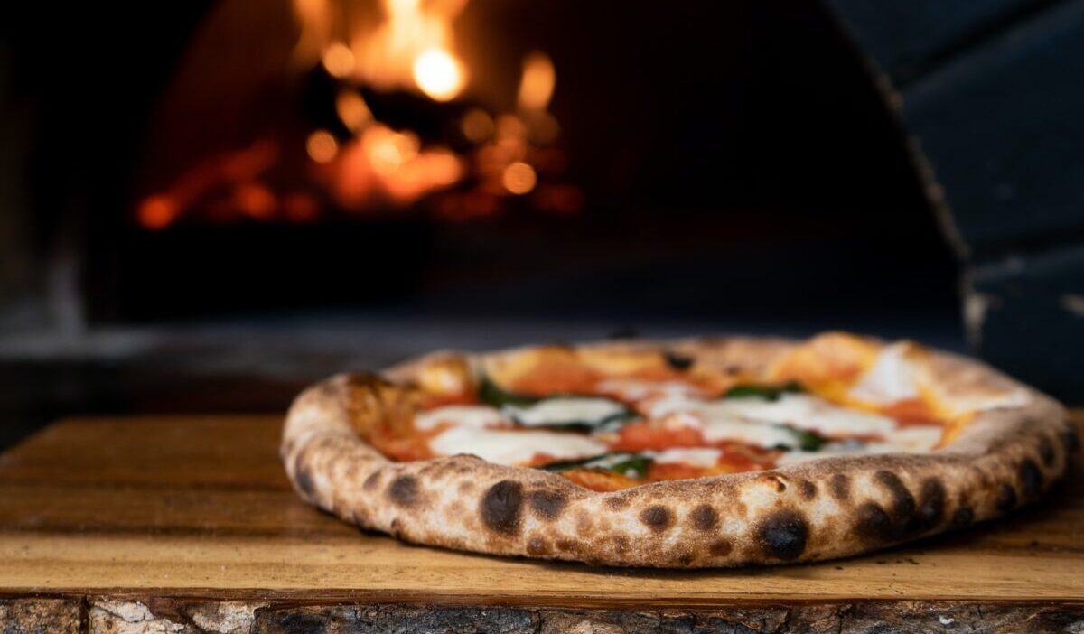 pizza on brown wooden table