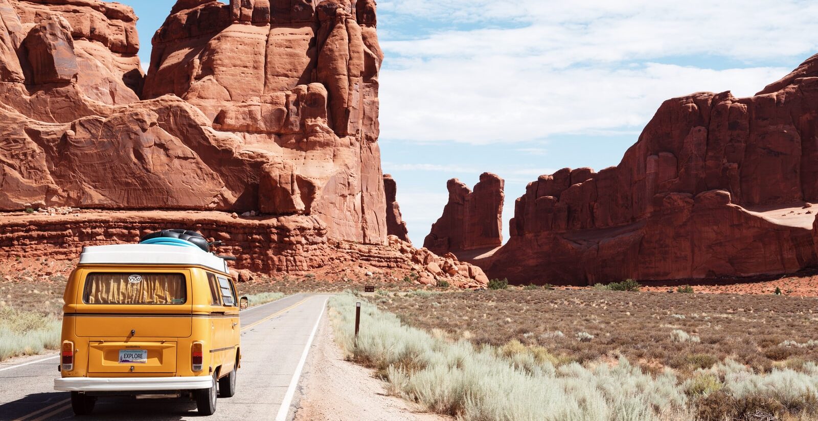 yellow Volkswagen van on road