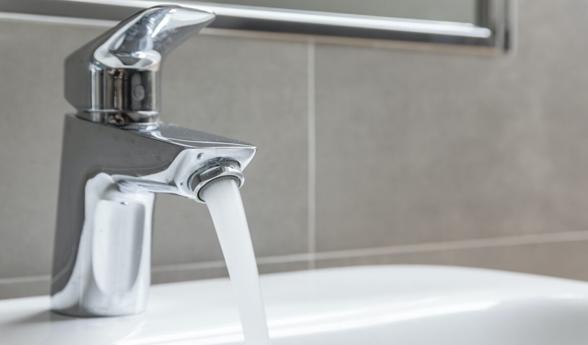 Chrome faucet with running water