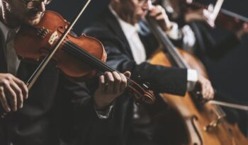 Symphonic string orchestra performing on stage