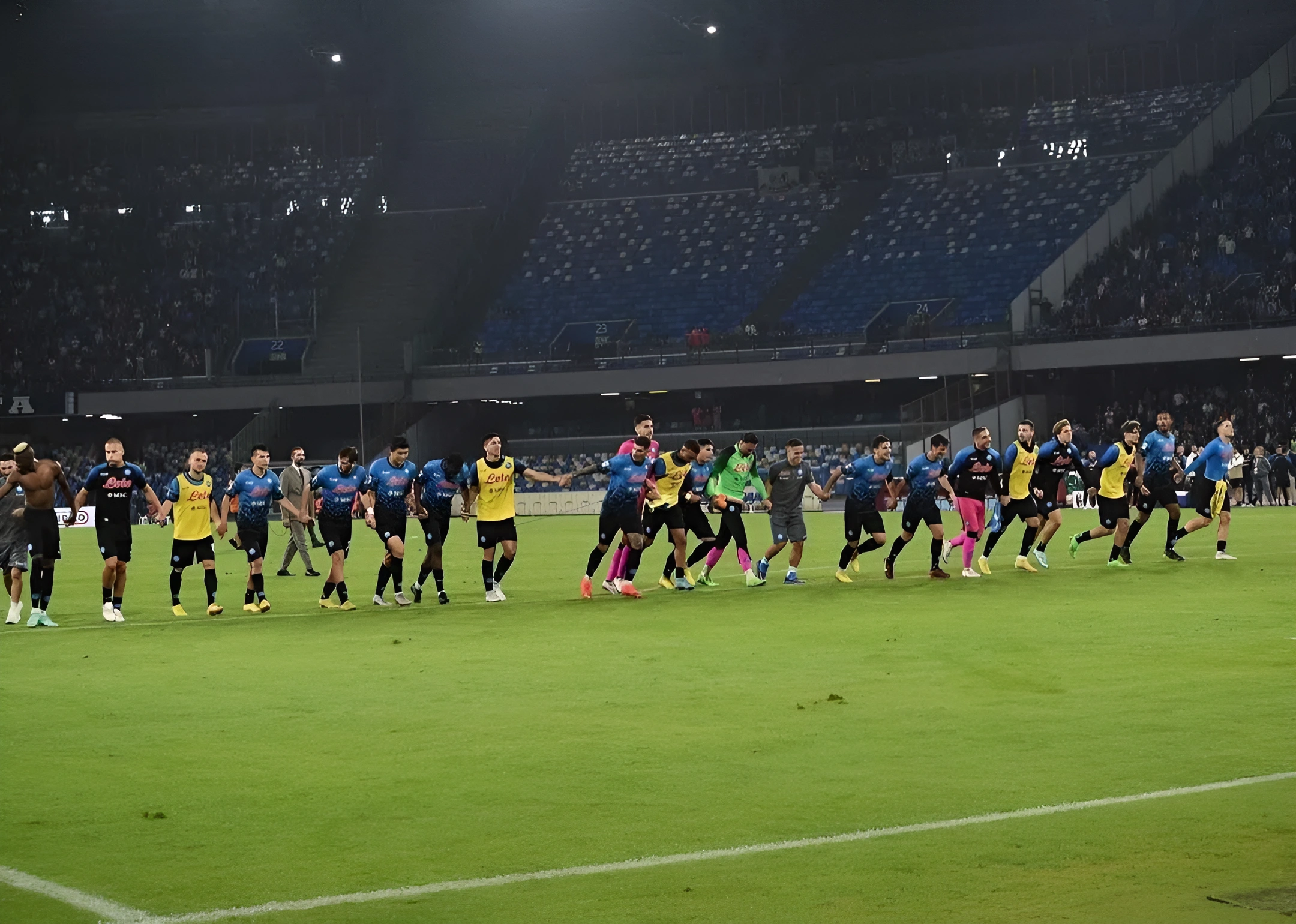 Napoli players cheering by shaking hands