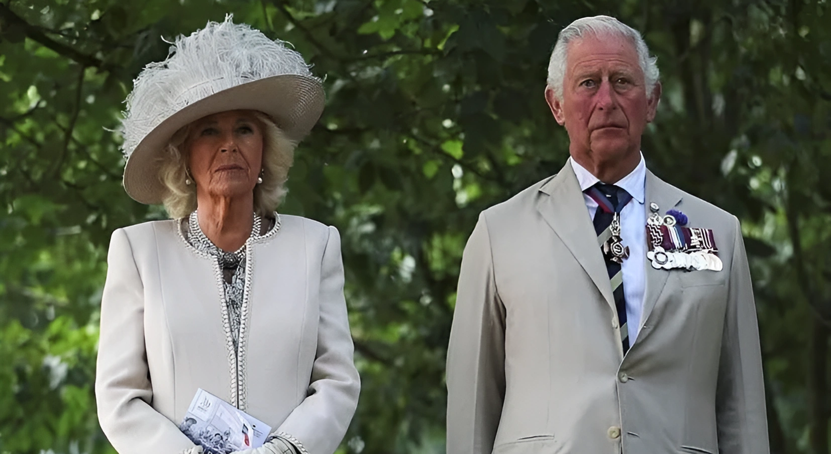 King Charles and Queen Camilla in robes of honor