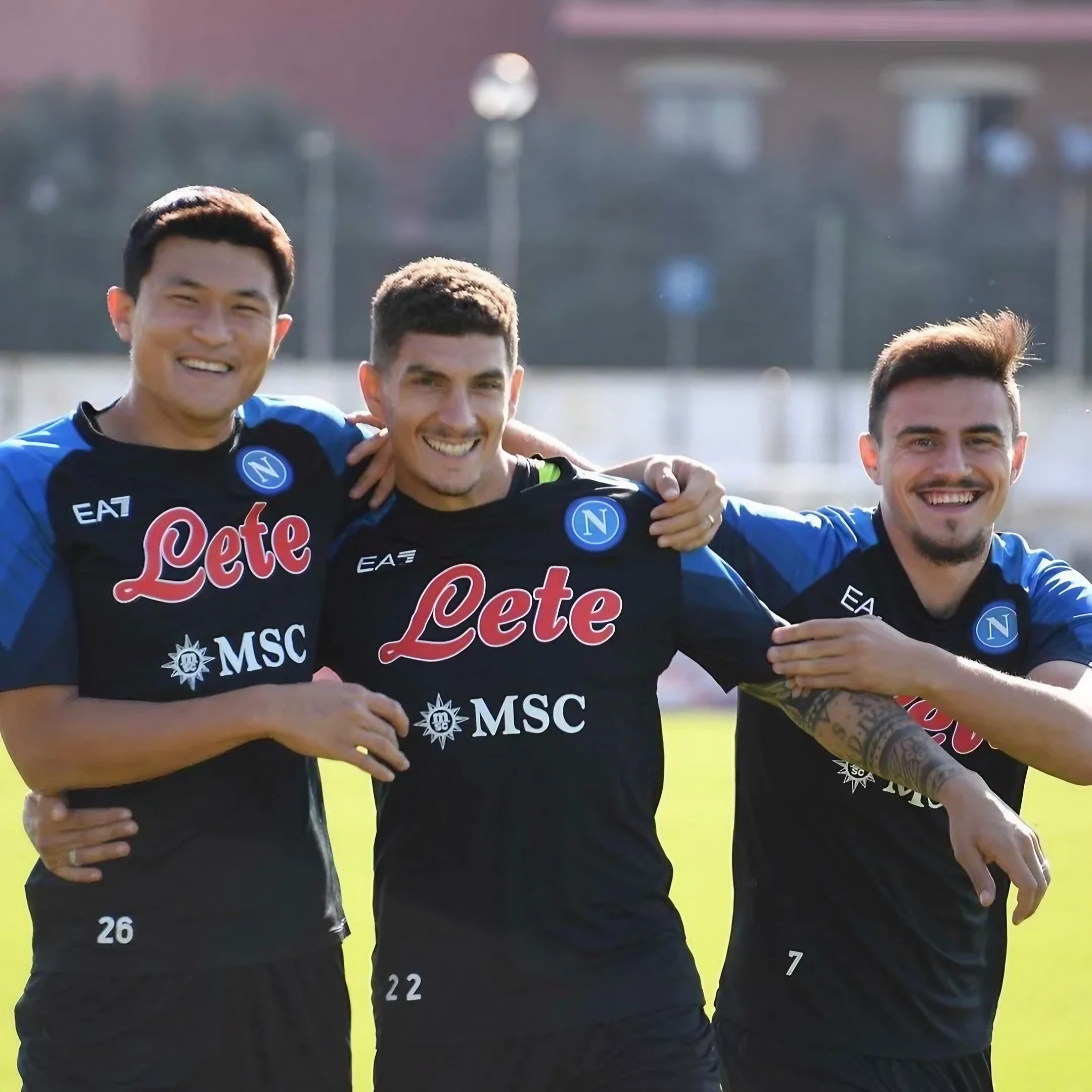 SSC Napoli players Minjae, Di Lorenzo and Elmas smile during a training session.