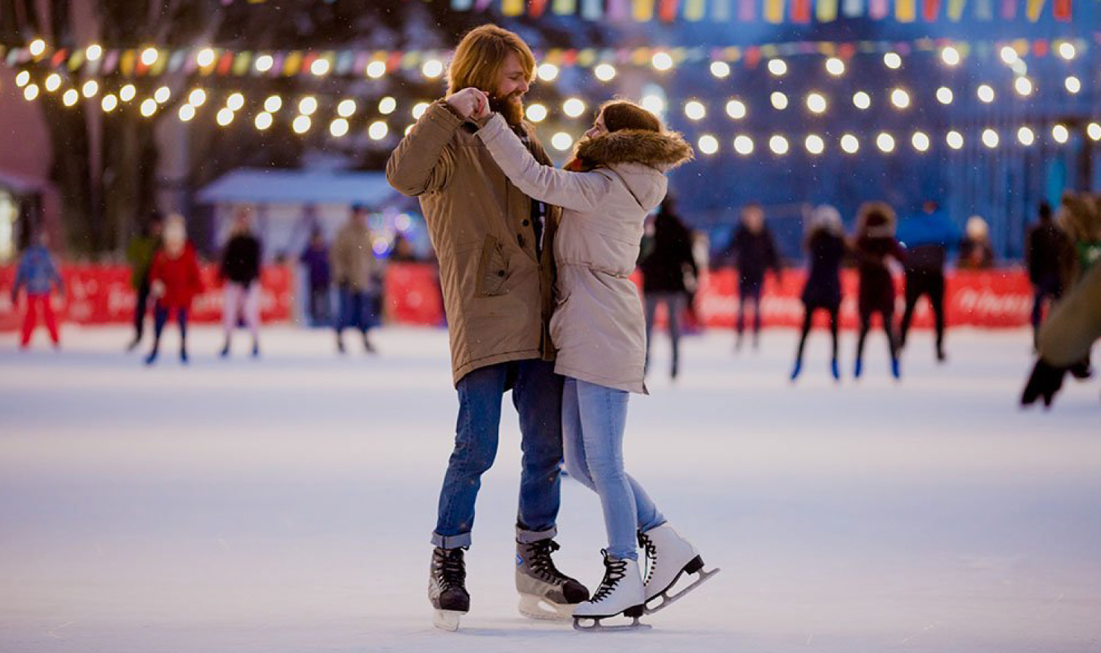 Two boys in love on a Christmas skating rink