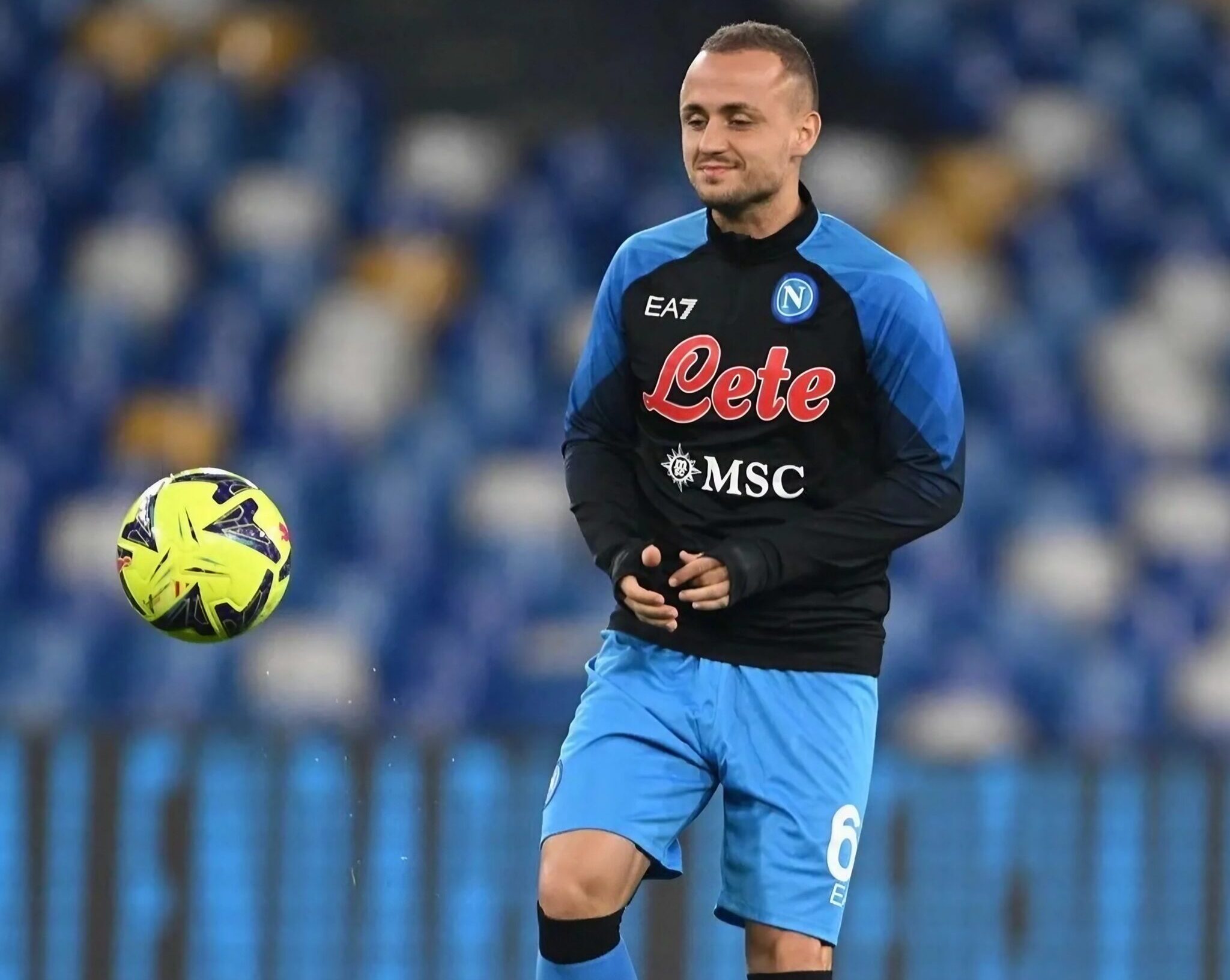 SSC Napoli footballer Lobotka warms up before a match