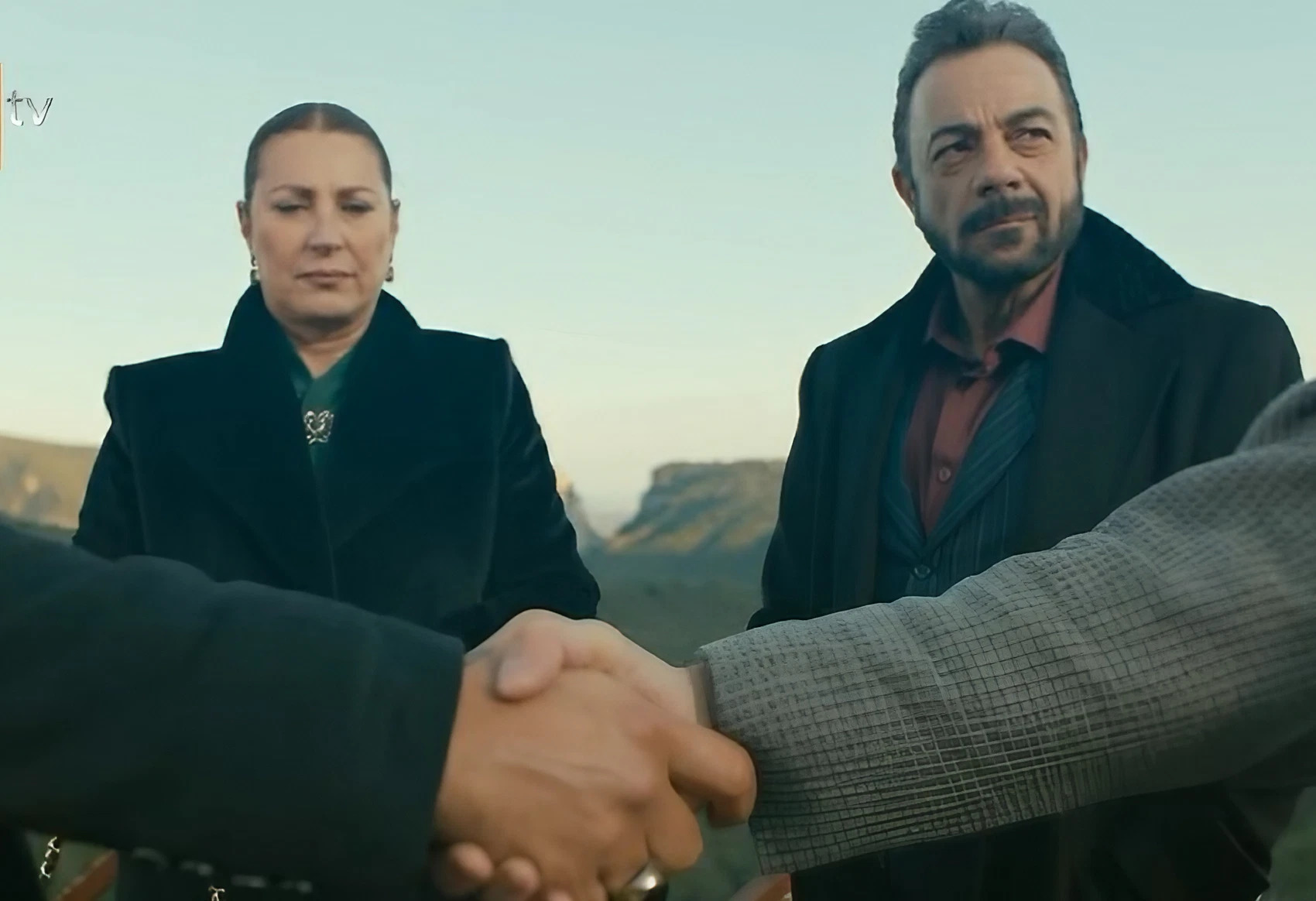 Demir and Yilmaz shake hands