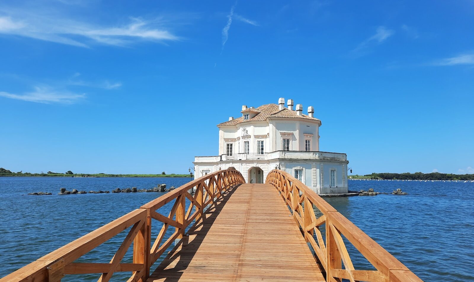 a long wooden bridge over a body of water