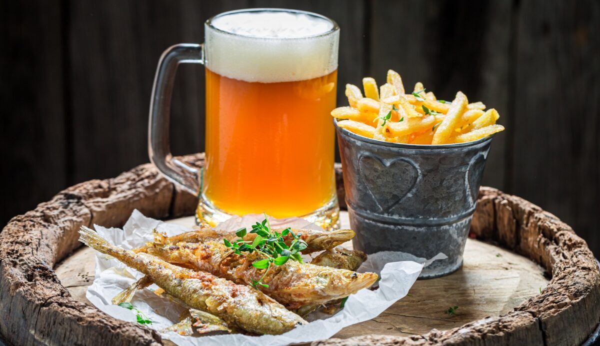 Homemade fried smelt fish with chips and cold beer