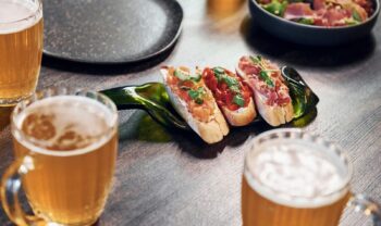 Close up view of food and beer on the table