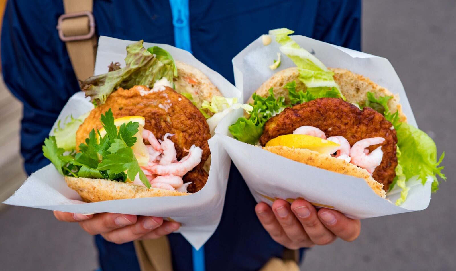 Fast street food seafood. Norway Lofoten Islands, fish cutlet wi