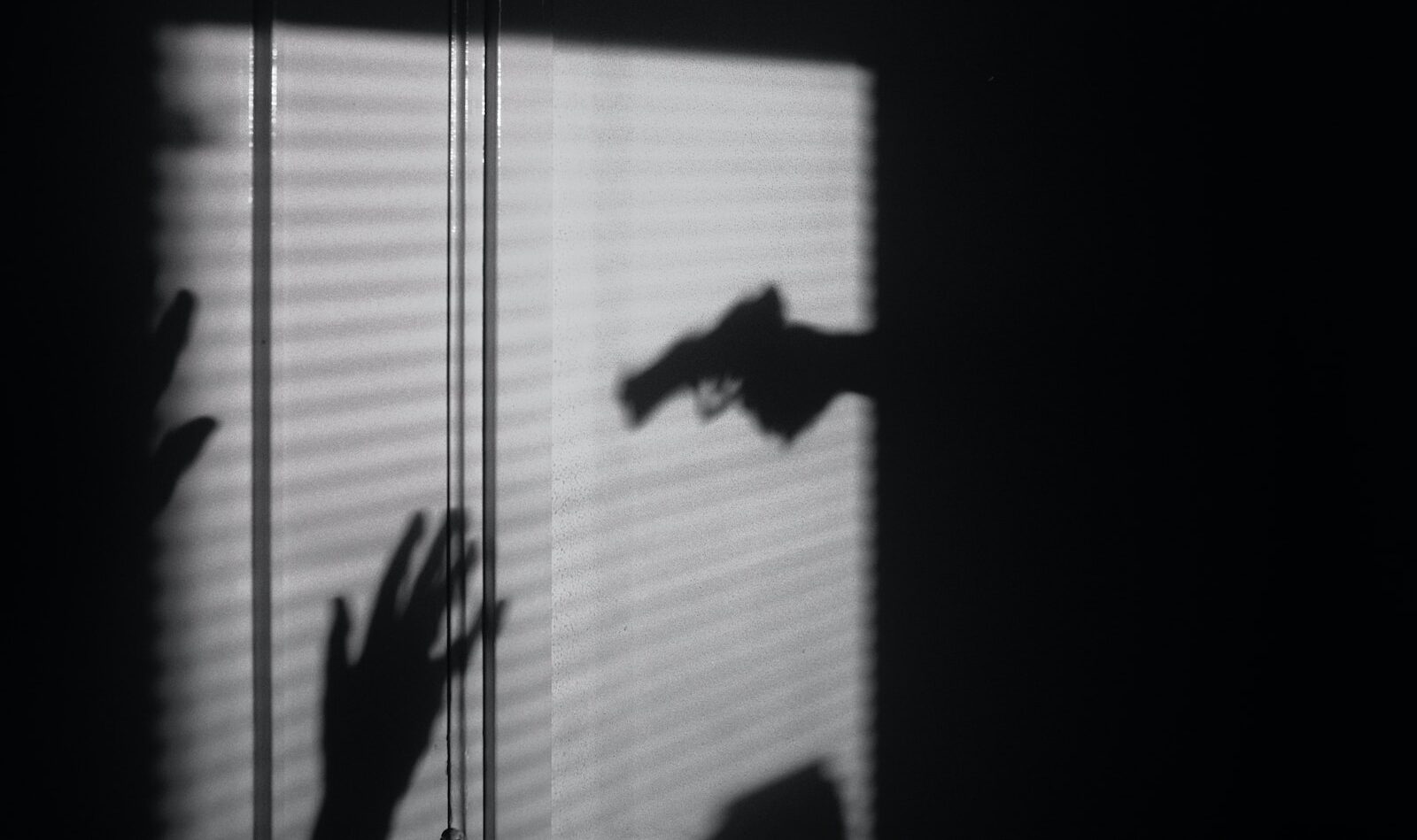 silhouette of person on window