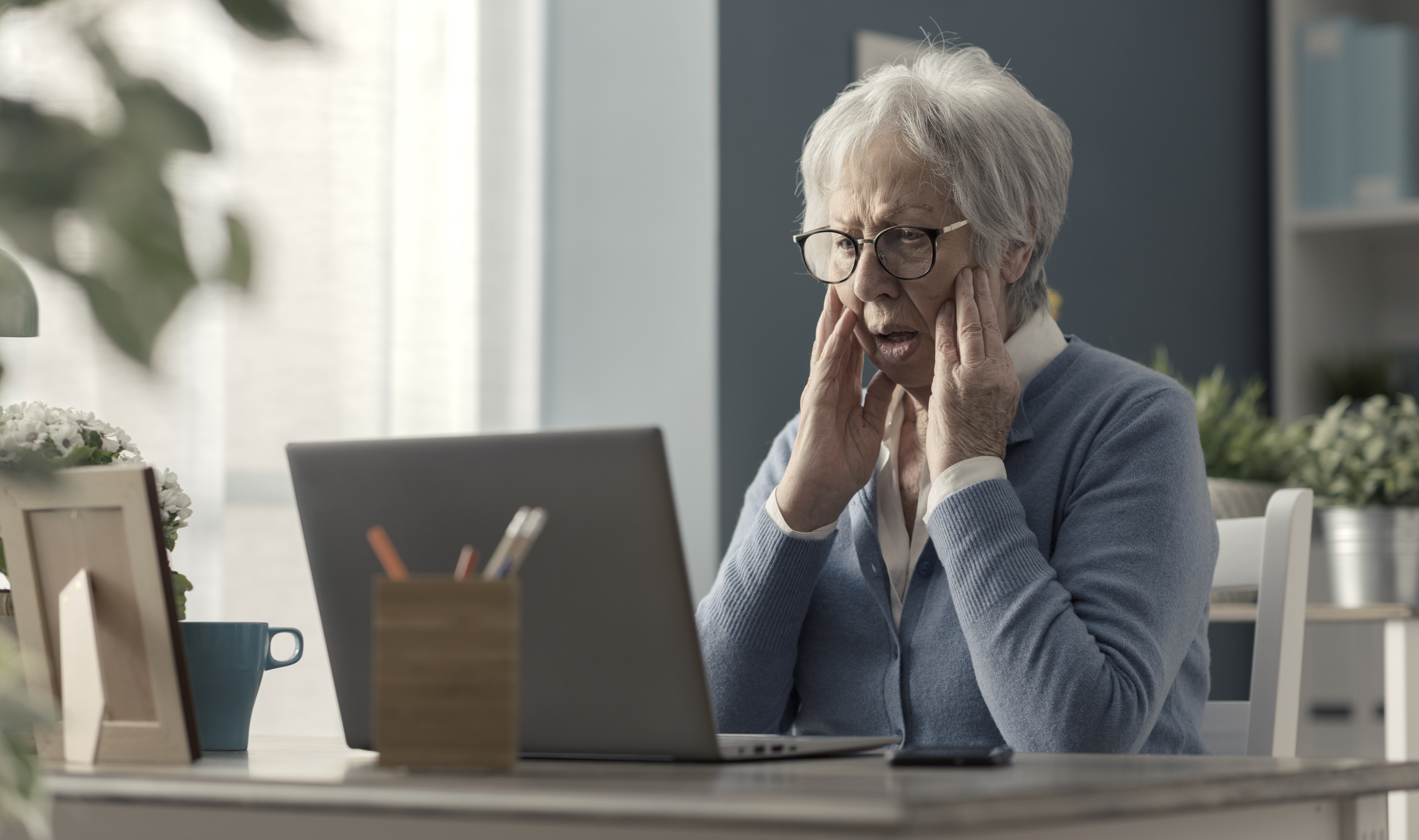 Senior woman struggling with technology