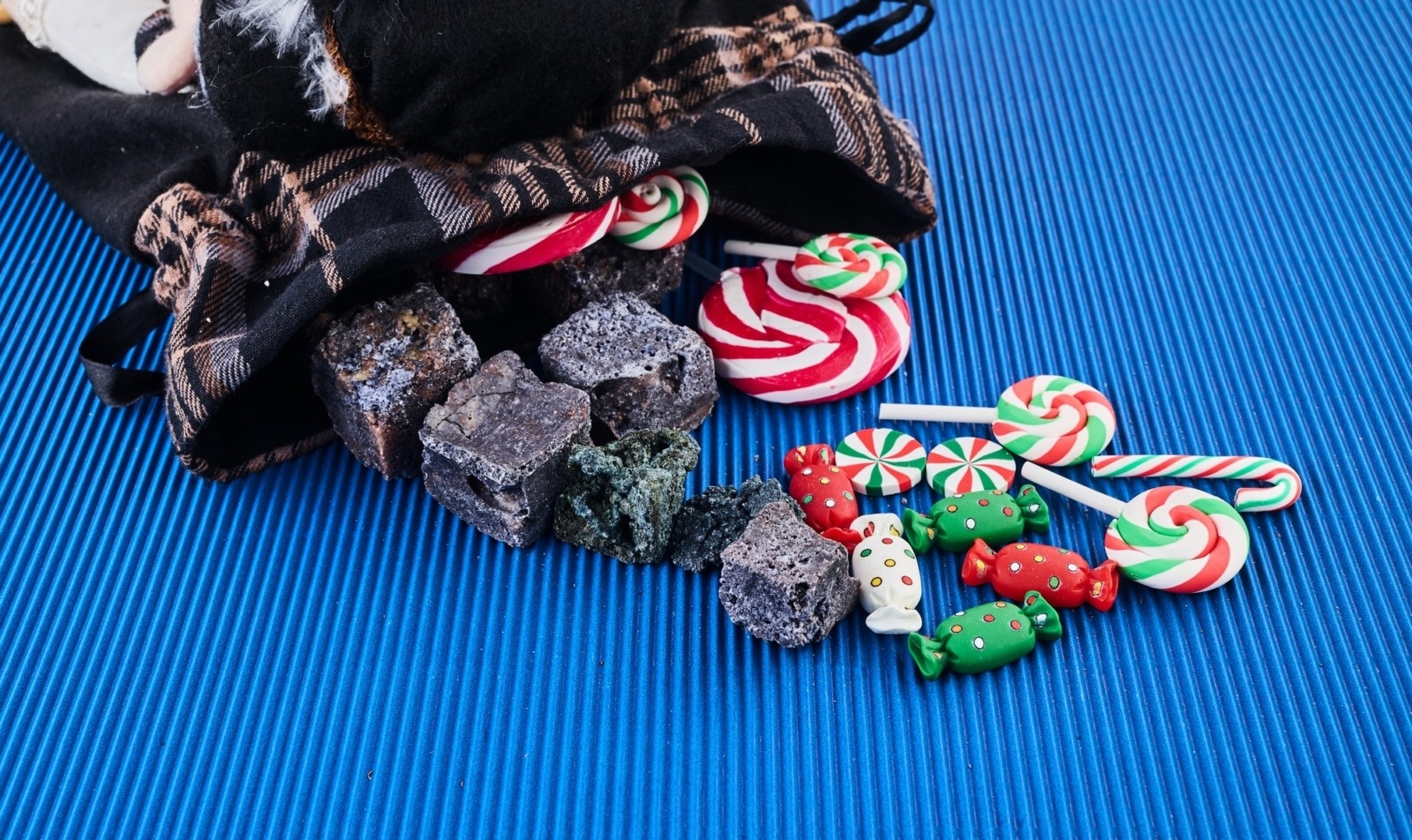 The Befana with sweet coal and candy. Italian Epiphany day tradition.