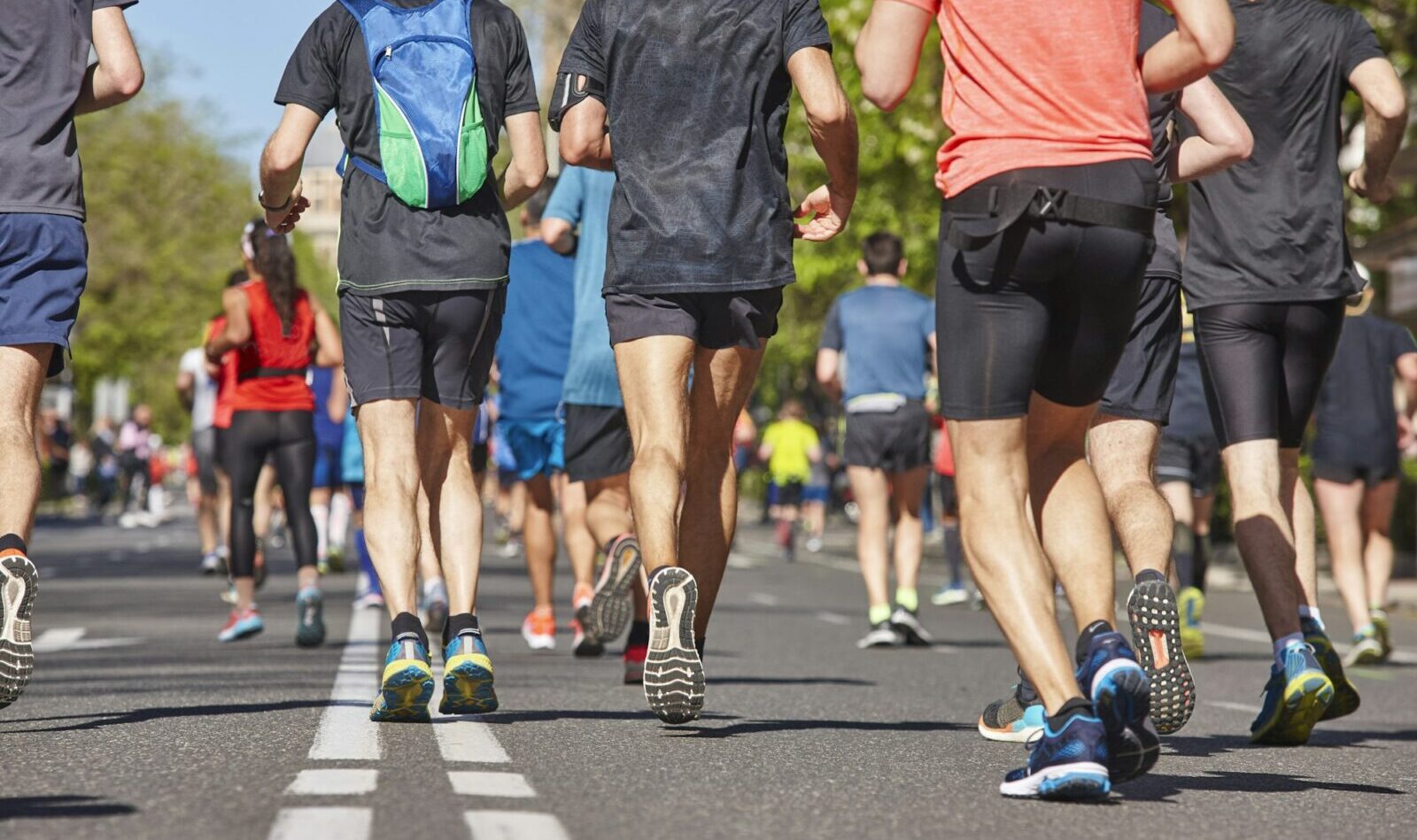 Marathon runners on the street. Healthy lifestyle. Urban athletes