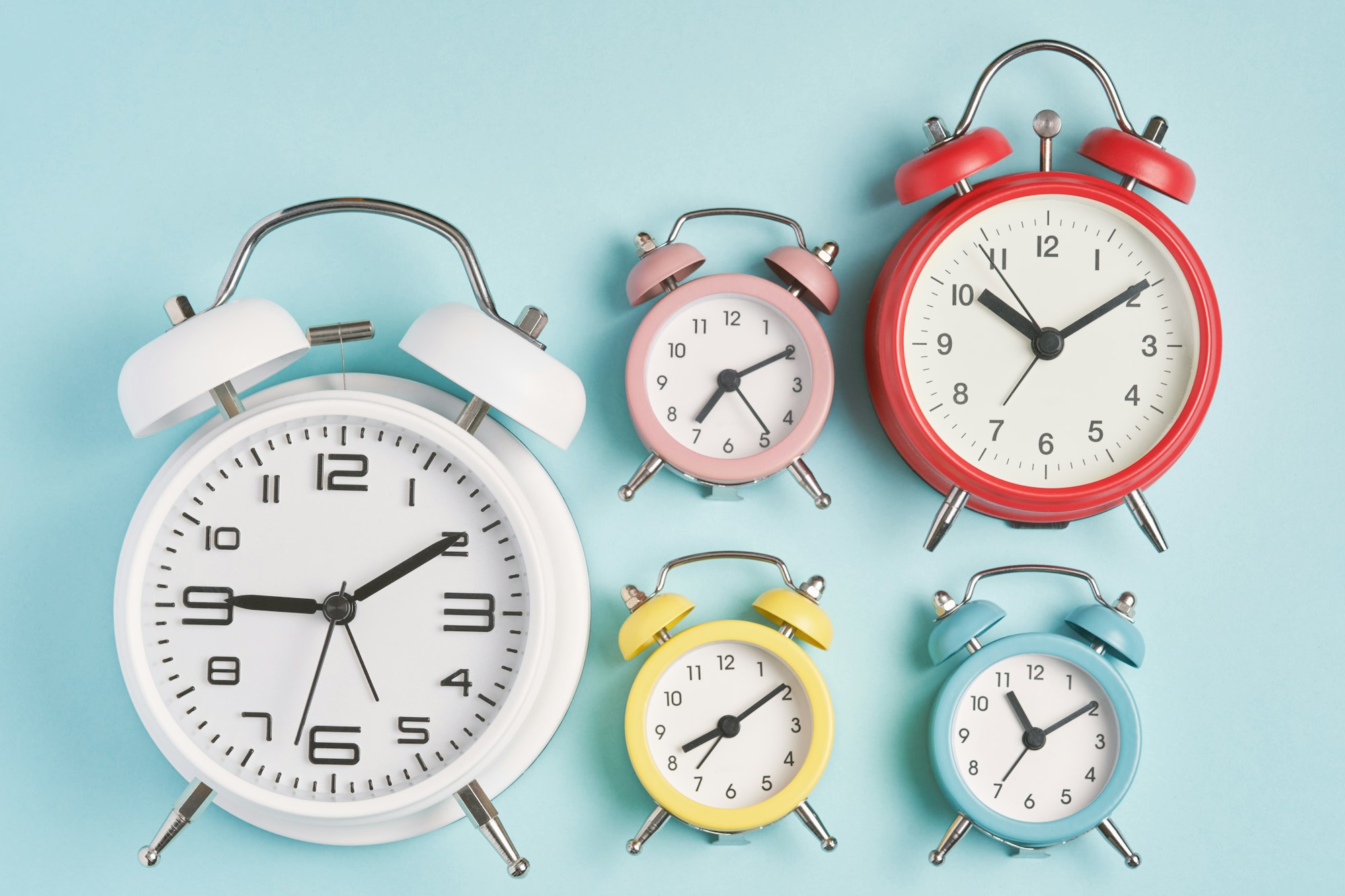 Collection of alarm clocks. Start of the day, waking up, morning, different time zones.