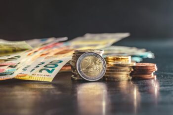 Euro coins on paper euro banknotes