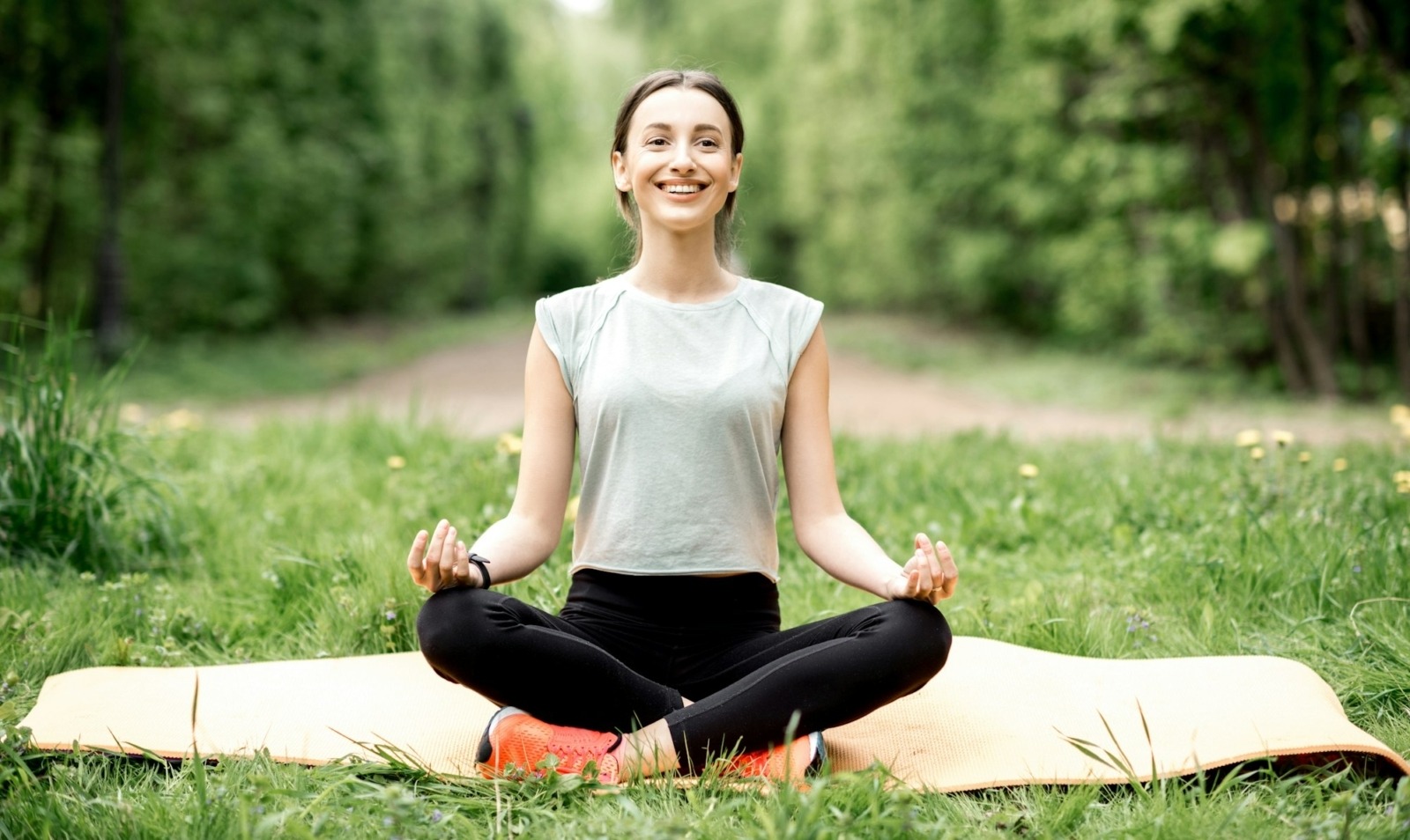 Young woman doing yoga in the park