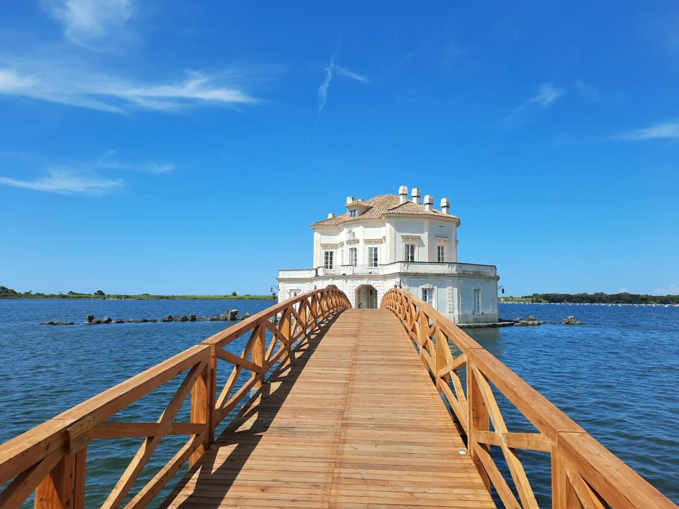 a long wooden bridge over a body of water