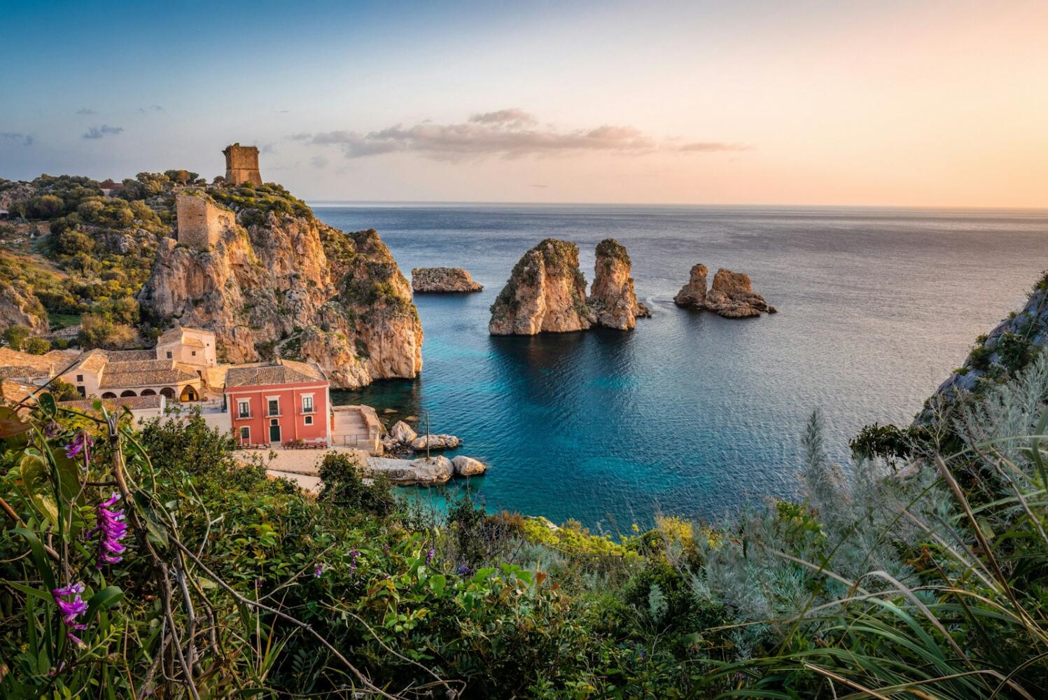 photo of house near cliff of capri and body of water